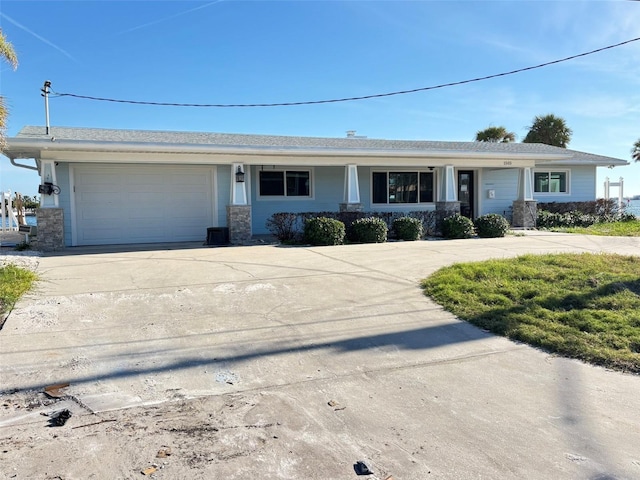 single story home featuring a garage