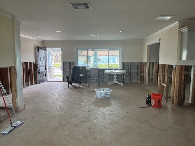 misc room featuring plenty of natural light and crown molding