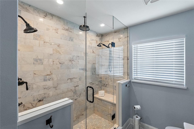 bathroom with a shower with shower door