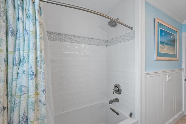 bathroom with shower / bath combo and ornamental molding