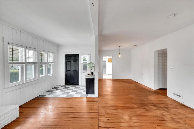 foyer entrance with light hardwood / wood-style floors