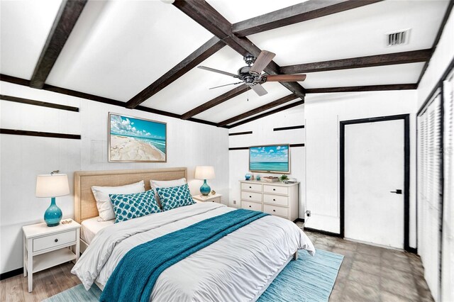 bedroom featuring vaulted ceiling with beams, ceiling fan, and light hardwood / wood-style flooring