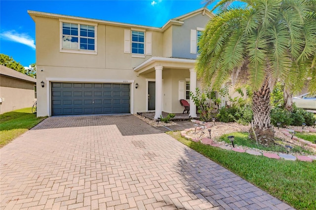 view of front of property with a garage