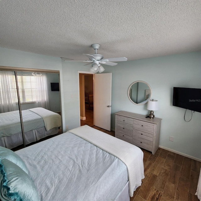 bedroom featuring ceiling fan, a textured ceiling, a closet, and dark hardwood / wood-style floors