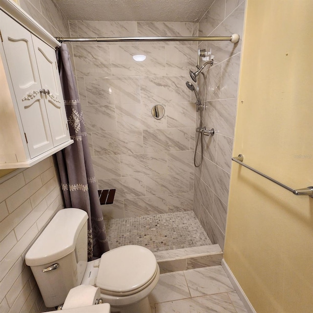 bathroom with toilet and a shower with shower curtain