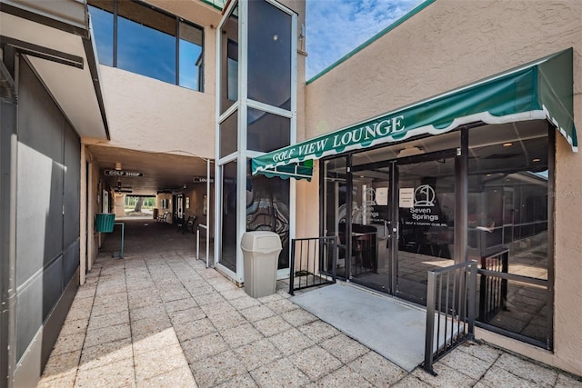 entrance to property featuring a patio