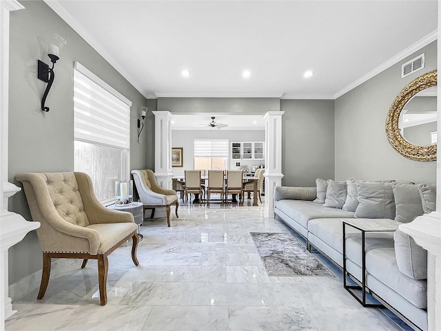 living room featuring ornate columns, ceiling fan, and ornamental molding