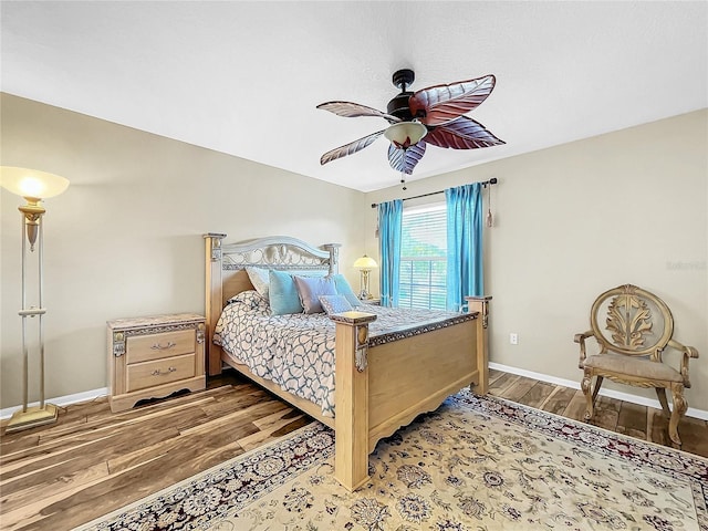 bedroom with wood-type flooring and ceiling fan