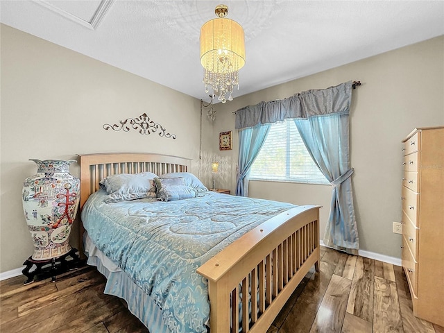 bedroom with dark hardwood / wood-style flooring