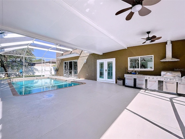 view of pool with glass enclosure, french doors, ceiling fan, area for grilling, and a patio