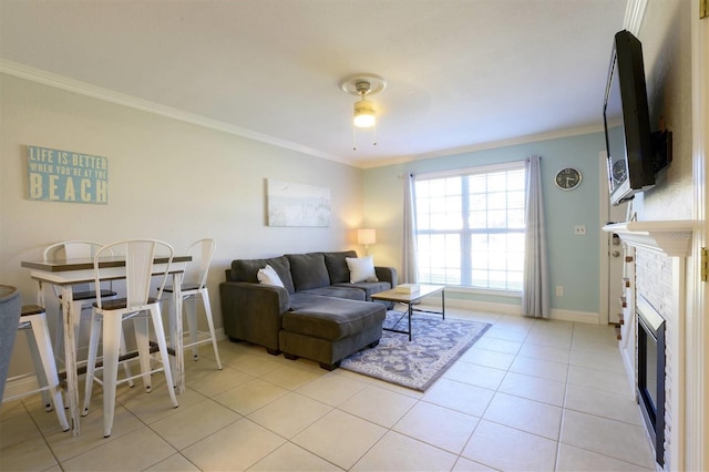 living room featuring ceiling fan, light tile patterned floors, and ornamental molding