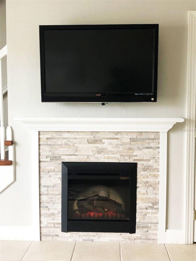 room details featuring tile patterned floors and a tile fireplace