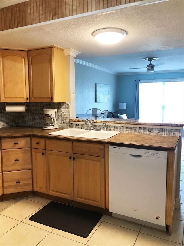 kitchen featuring dishwasher, ceiling fan, light tile patterned flooring, and sink