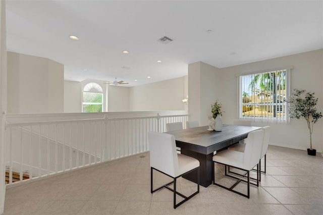 dining space featuring ceiling fan and light tile patterned flooring