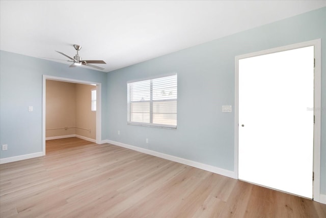 empty room with light hardwood / wood-style floors and ceiling fan