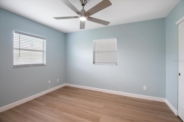 unfurnished room featuring light wood-type flooring and ceiling fan