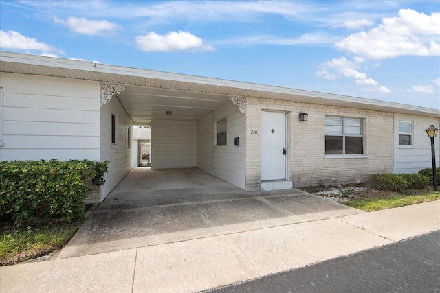 view of front of property with a carport