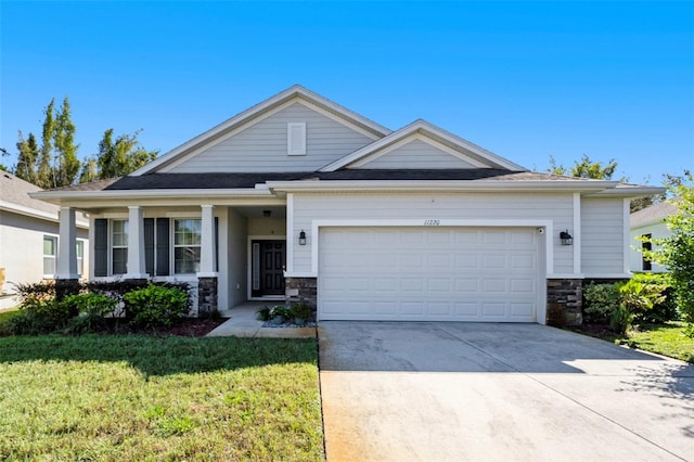 view of front facade with a front yard and a garage