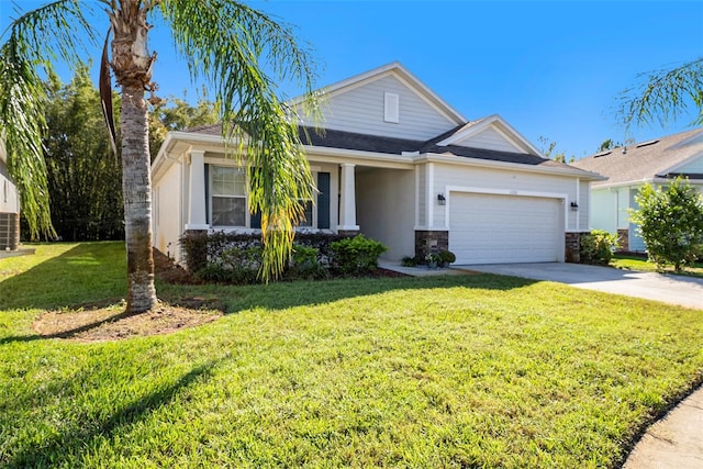 view of front facade featuring a front yard and a garage