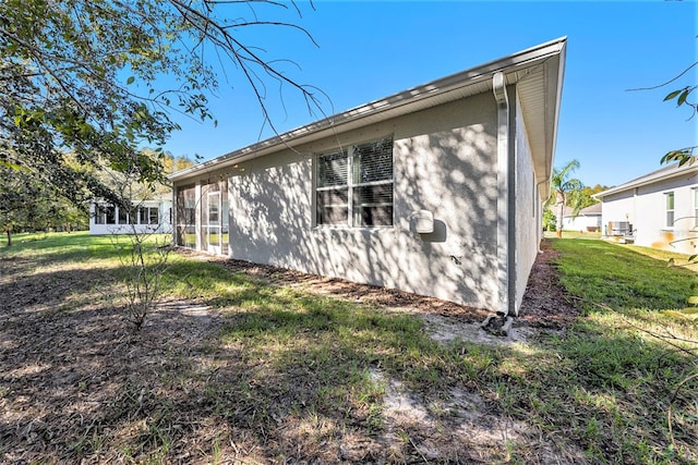 rear view of house featuring a lawn