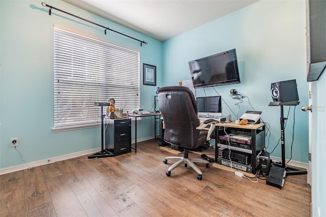 office space with light wood-type flooring