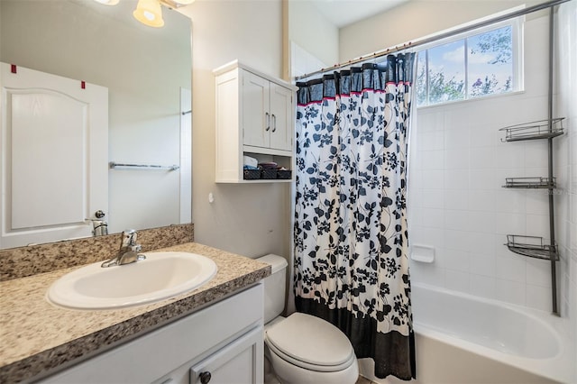 full bathroom with vanity, shower / bathtub combination with curtain, and toilet