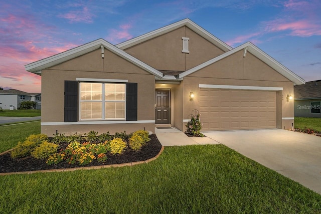 684 SE 65th Ter, Ocala, FL 34472 - view of front of property featuring stucco siding, a garage, driveway, and a front lawn