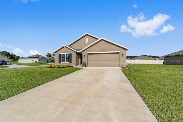 684 SE 65th Ter, Ocala, FL 34472 - view of front facade with an attached garage, concrete driveway, and stucco siding