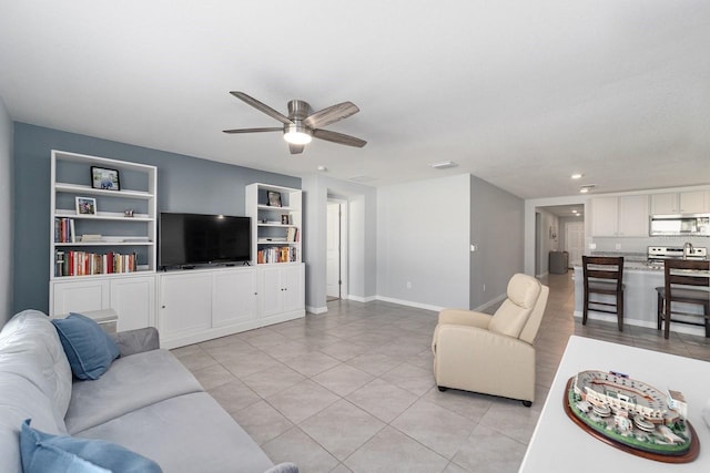 684 SE 65th Ter, Ocala, FL 34472 - living room featuring light tile patterned floors, ceiling fan, built in features, baseboards, and recessed lighting