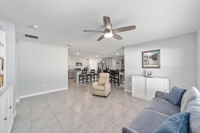 684 SE 65th Ter, Ocala, FL 34472 - living area featuring a ceiling fan, light tile patterned floors, baseboards, and recessed lighting