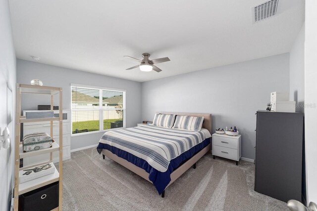 684 SE 65th Ter, Ocala, FL 34472 - bedroom featuring carpet, baseboards, and a ceiling fan