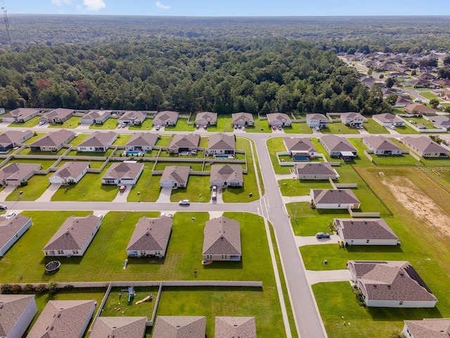 684 SE 65th Ter, Ocala, FL 34472 - aerial view of residential area featuring a heavily wooded area