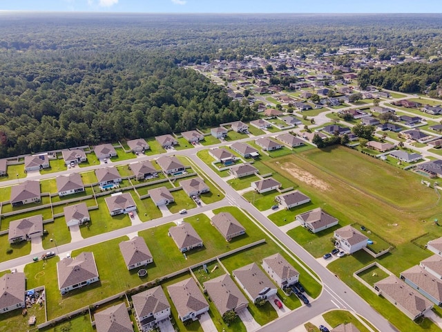 684 SE 65th Ter, Ocala, FL 34472 - aerial view of property's location with nearby suburban area and a heavily wooded area