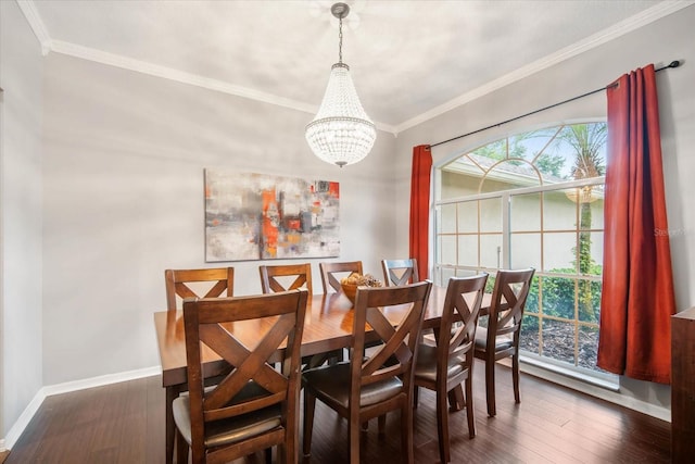 dining space with dark hardwood / wood-style floors, a chandelier, and crown molding