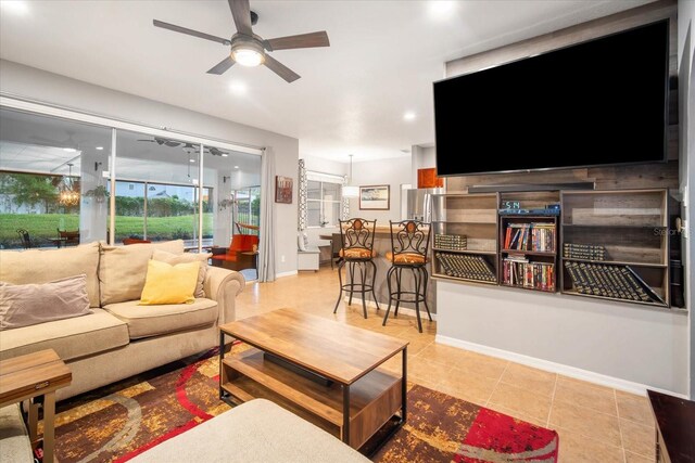 tiled living room with ceiling fan