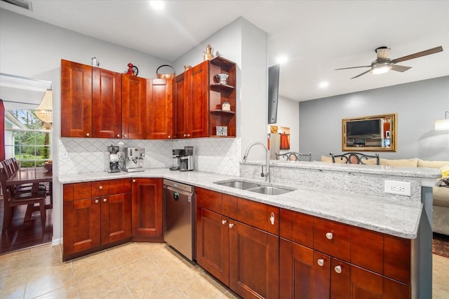 kitchen featuring dishwasher, light stone counters, sink, kitchen peninsula, and ceiling fan