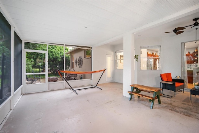 sunroom featuring ceiling fan