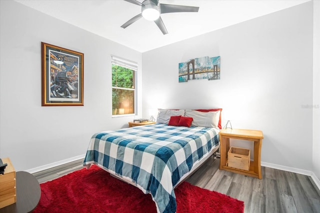 bedroom with wood-type flooring and ceiling fan