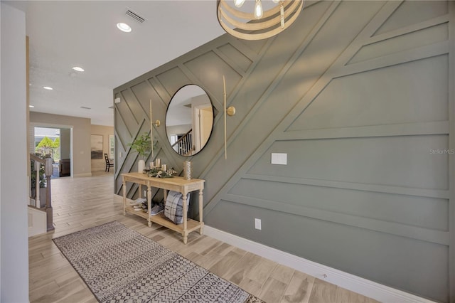 foyer with light hardwood / wood-style floors