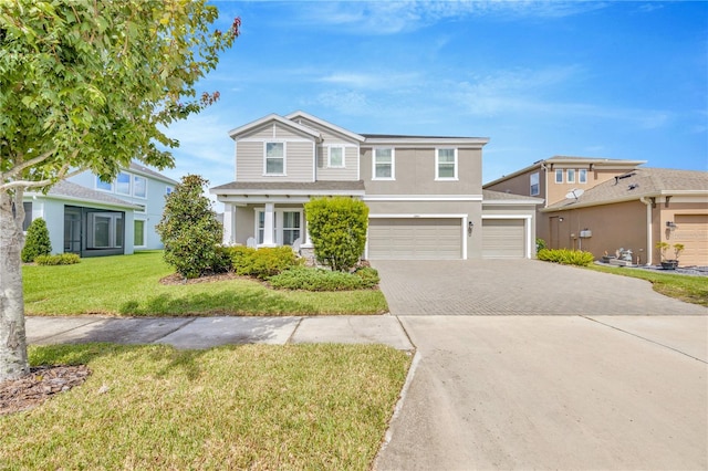 view of front of house with a front lawn and a garage