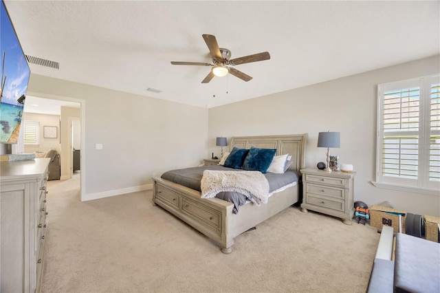 carpeted bedroom with ceiling fan