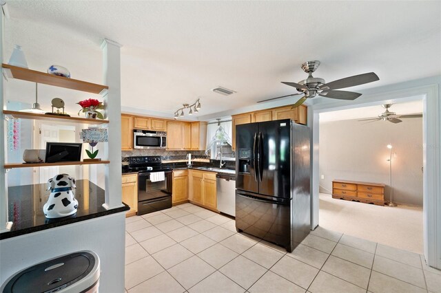 kitchen featuring sink, backsplash, black appliances, ceiling fan, and light brown cabinetry