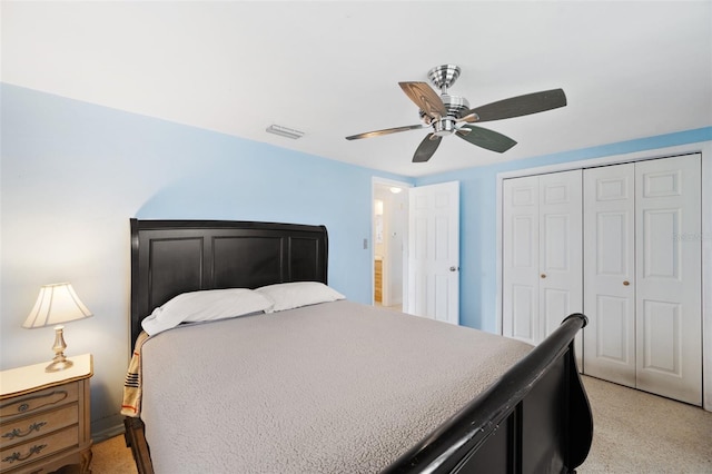 bedroom featuring ceiling fan and a closet