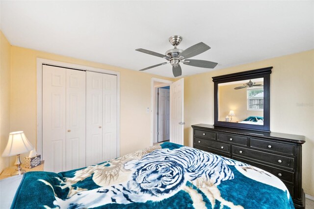 bedroom featuring ceiling fan and a closet