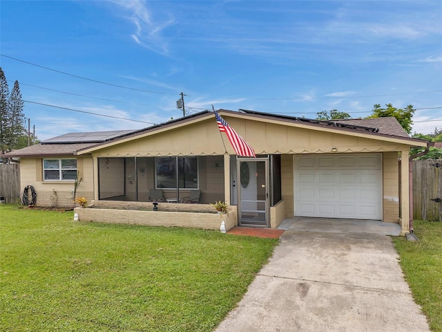 single story home featuring a garage and a front lawn