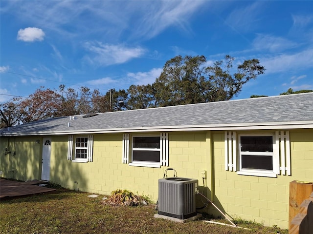 view of side of home featuring cooling unit