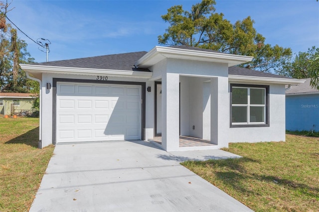 view of front of house featuring a garage and a front yard