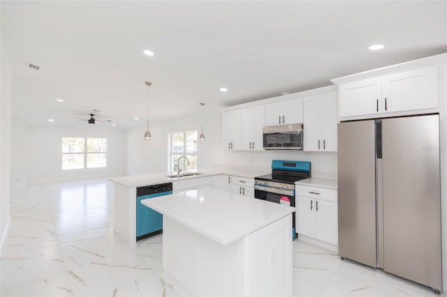 kitchen with appliances with stainless steel finishes, sink, hanging light fixtures, a center island, and kitchen peninsula