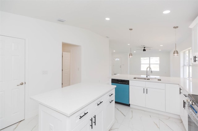 kitchen with sink, white cabinetry, a center island, hanging light fixtures, and stainless steel appliances