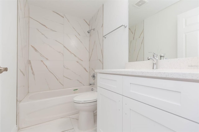 full bathroom featuring vanity, toilet, and tiled shower / bath